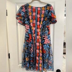 Sheer dress with embroidered flowers